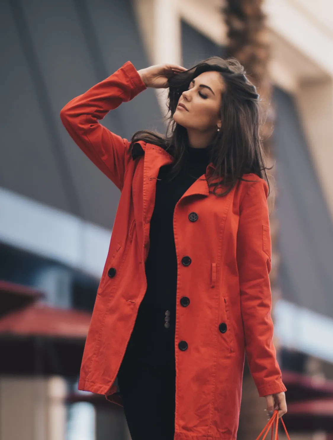 a woman in a red coat