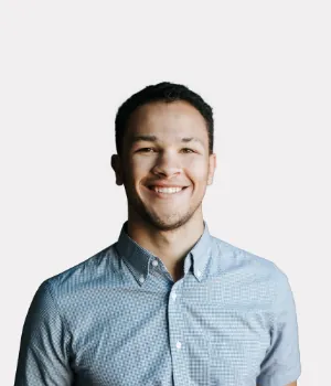 a man smiling at the camera